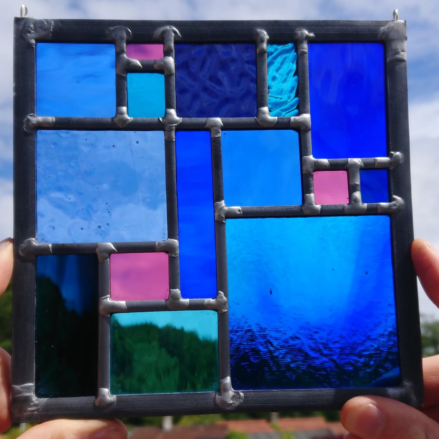 Stained glass geometric leaded panel - blue and electric pink. 