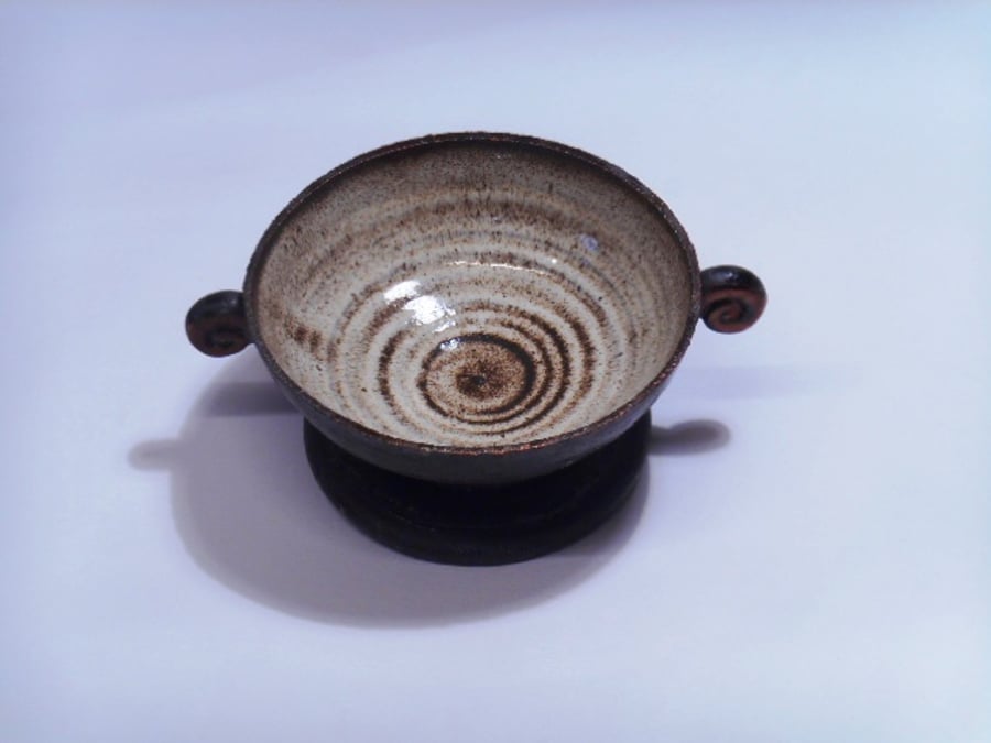 Black clay stemmed petite bowl.