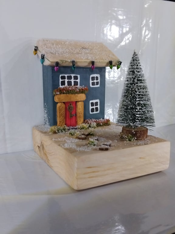 Snowy village with festive red door
