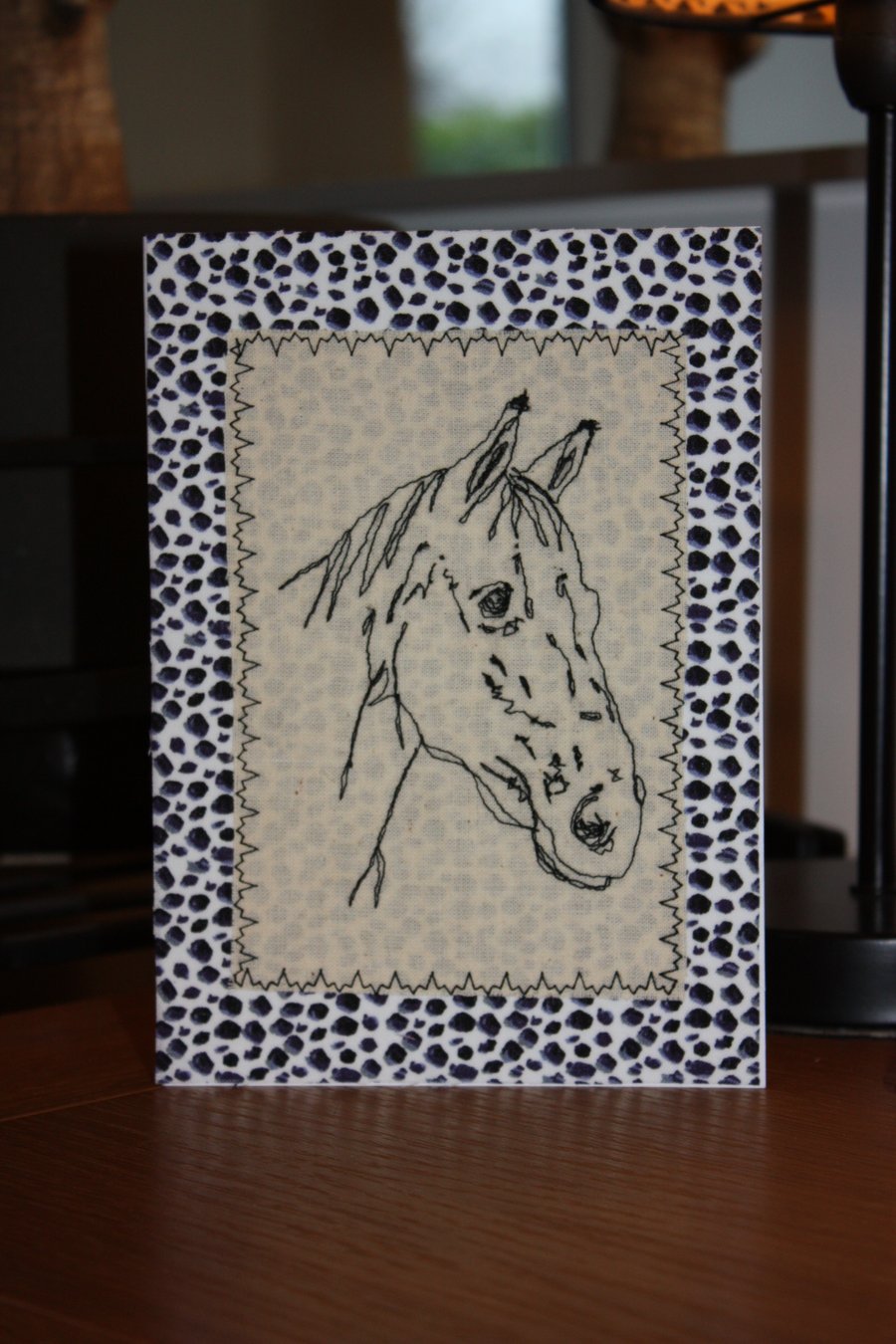 Horse head with an animal print border