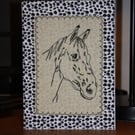 Horse head with an animal print border