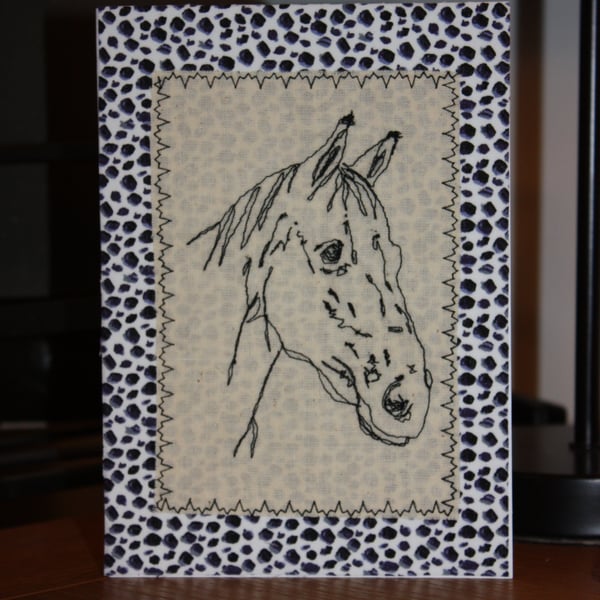 Horse head with an animal print border