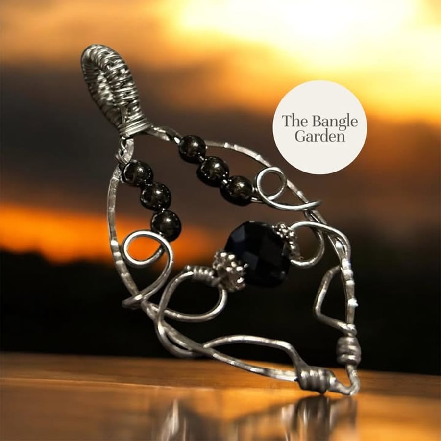 Wire wrapped silver & black pendant