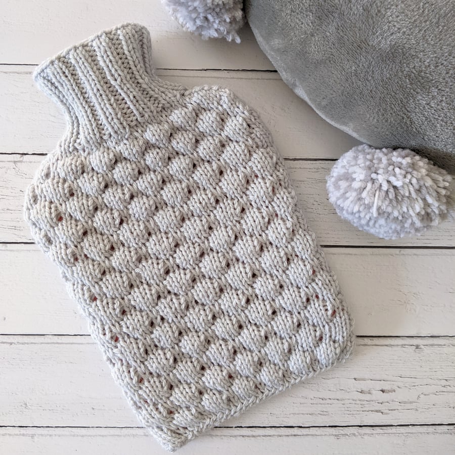 Grey hand knitted hot water bottle cover