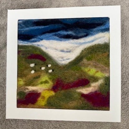 Sheep on the glenn felted picture.