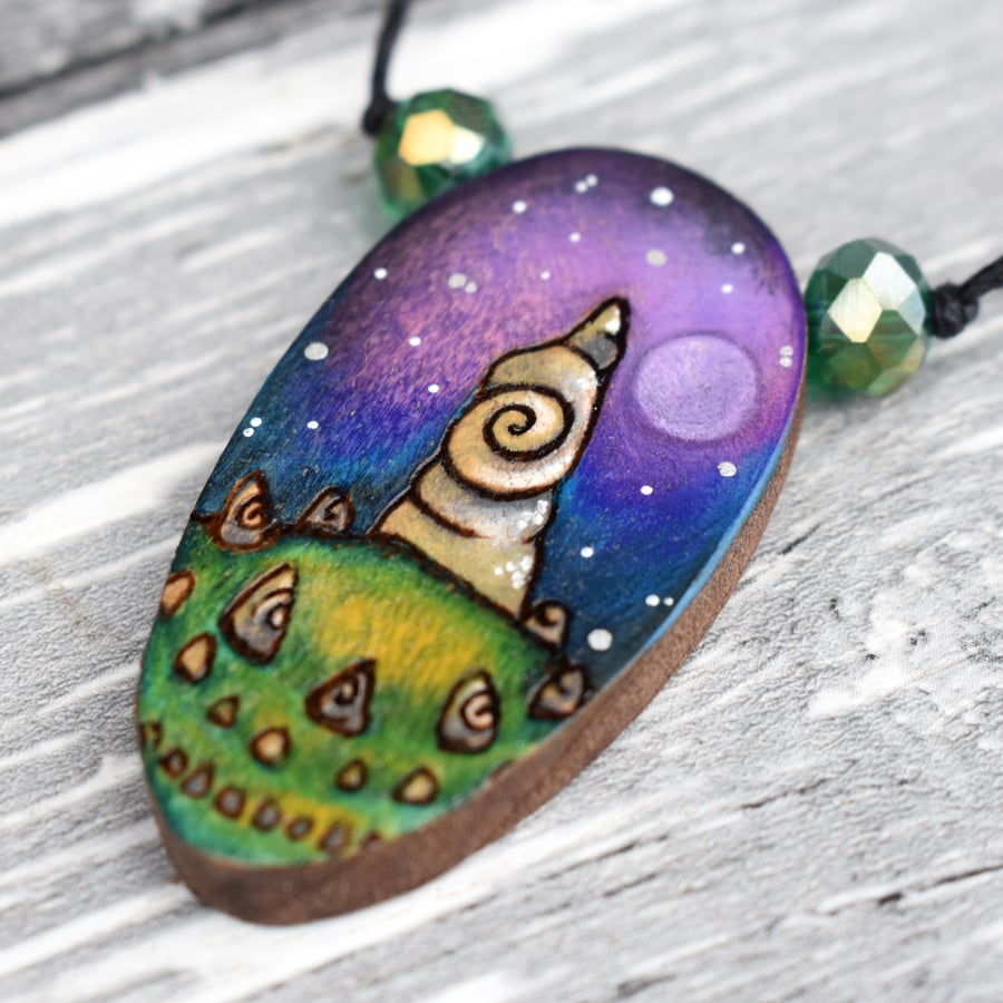 Standing stones under a full moon pyrography pendant. Wooden oval pendant.