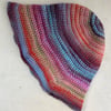 Multicoloured hand crocheted hat.