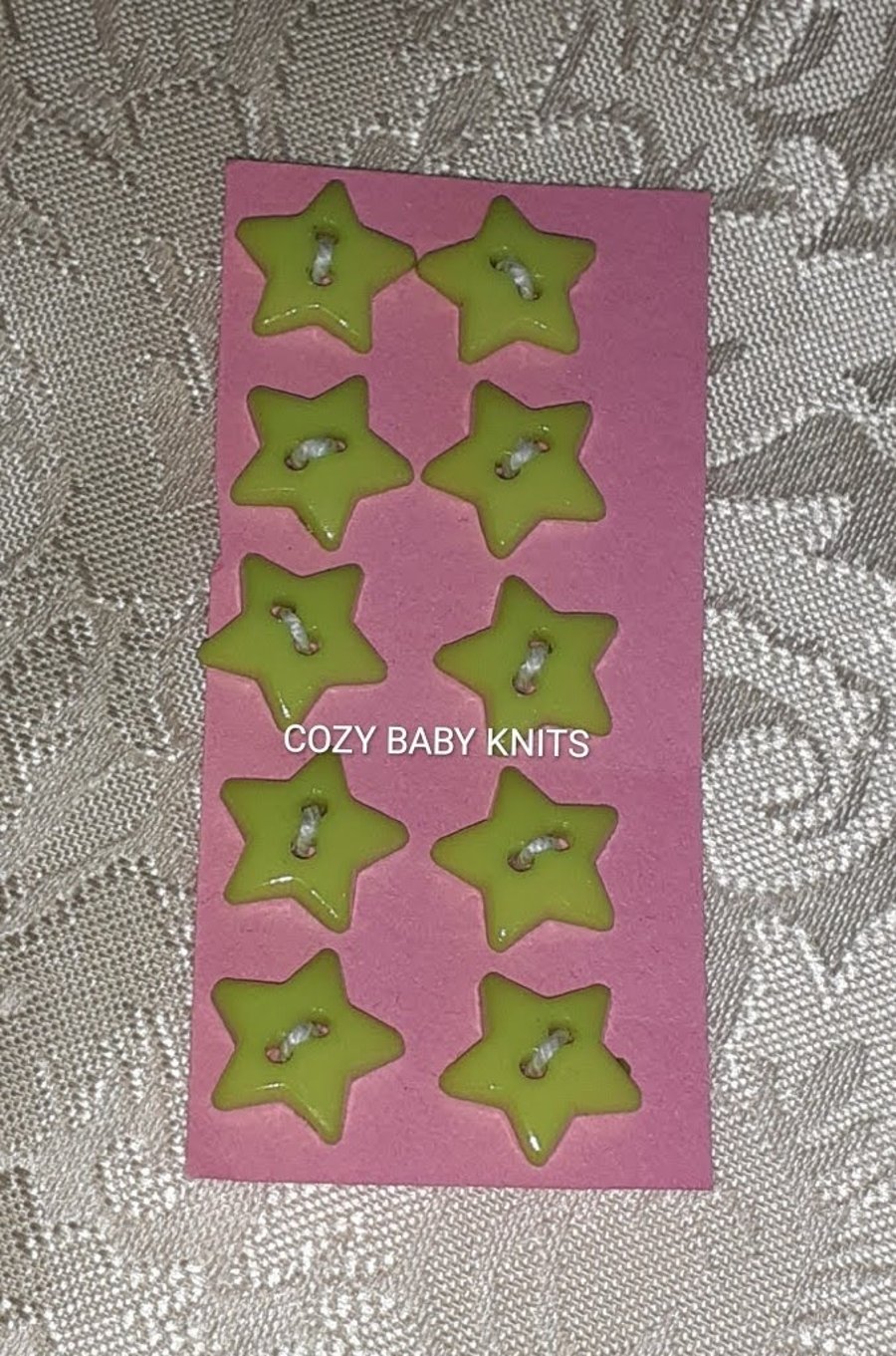 Pale green star plastic buttons