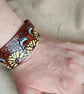 Handmade Leather Bracelet with a Surreal Design. Dolphins and Sunflowers - Image 6