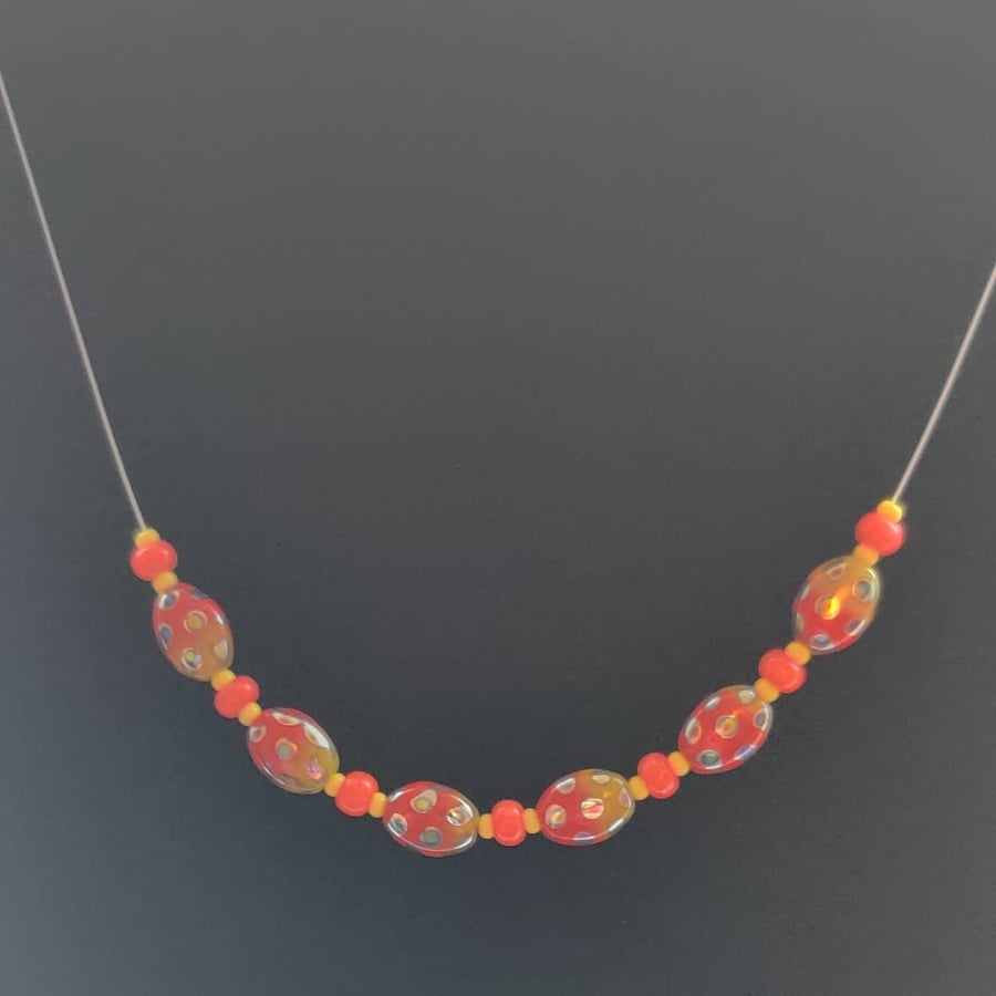 Orange and Yellow beetle bead necklace