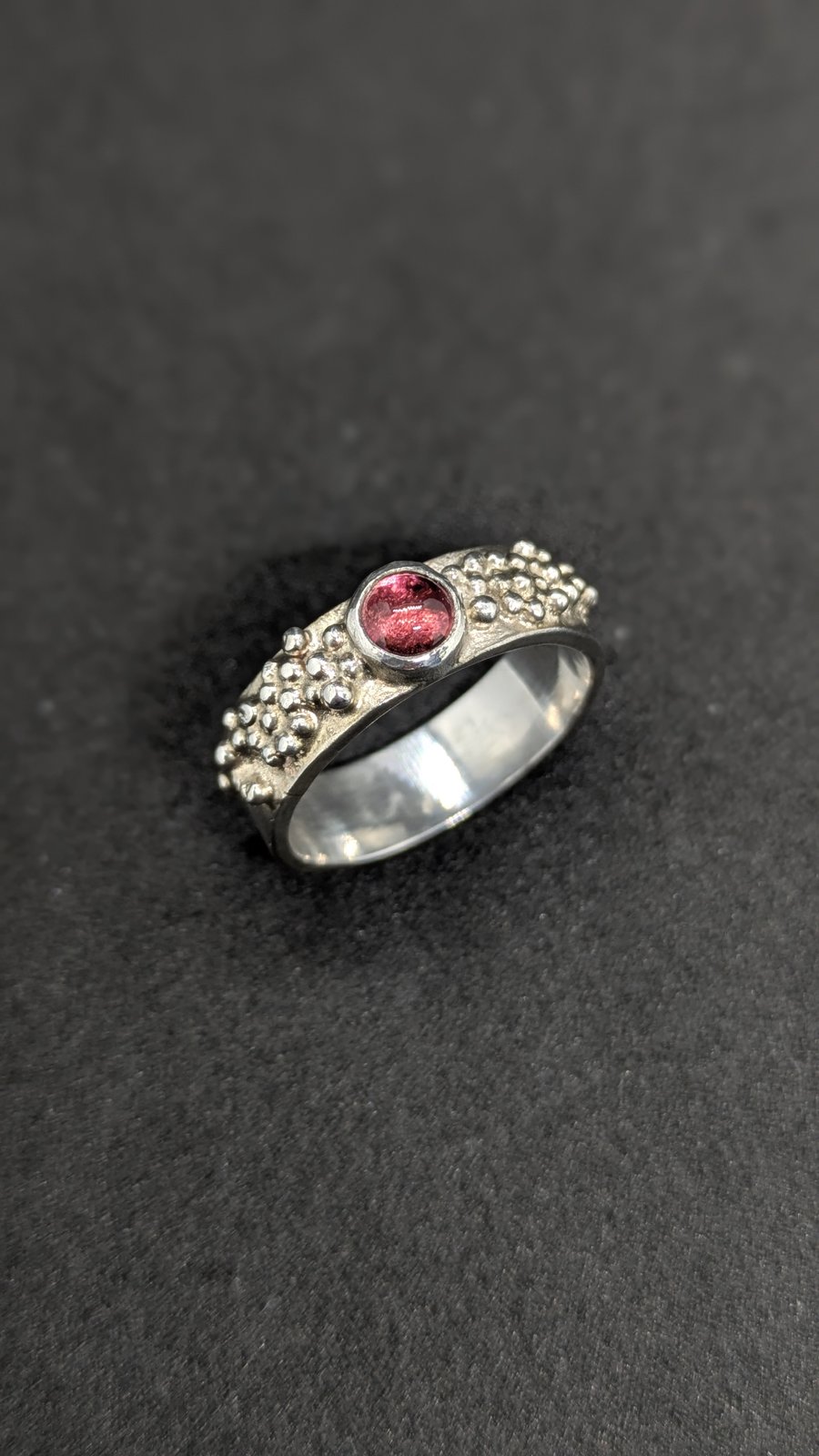Sterling silver band ring with granulation and pink tourmaline 