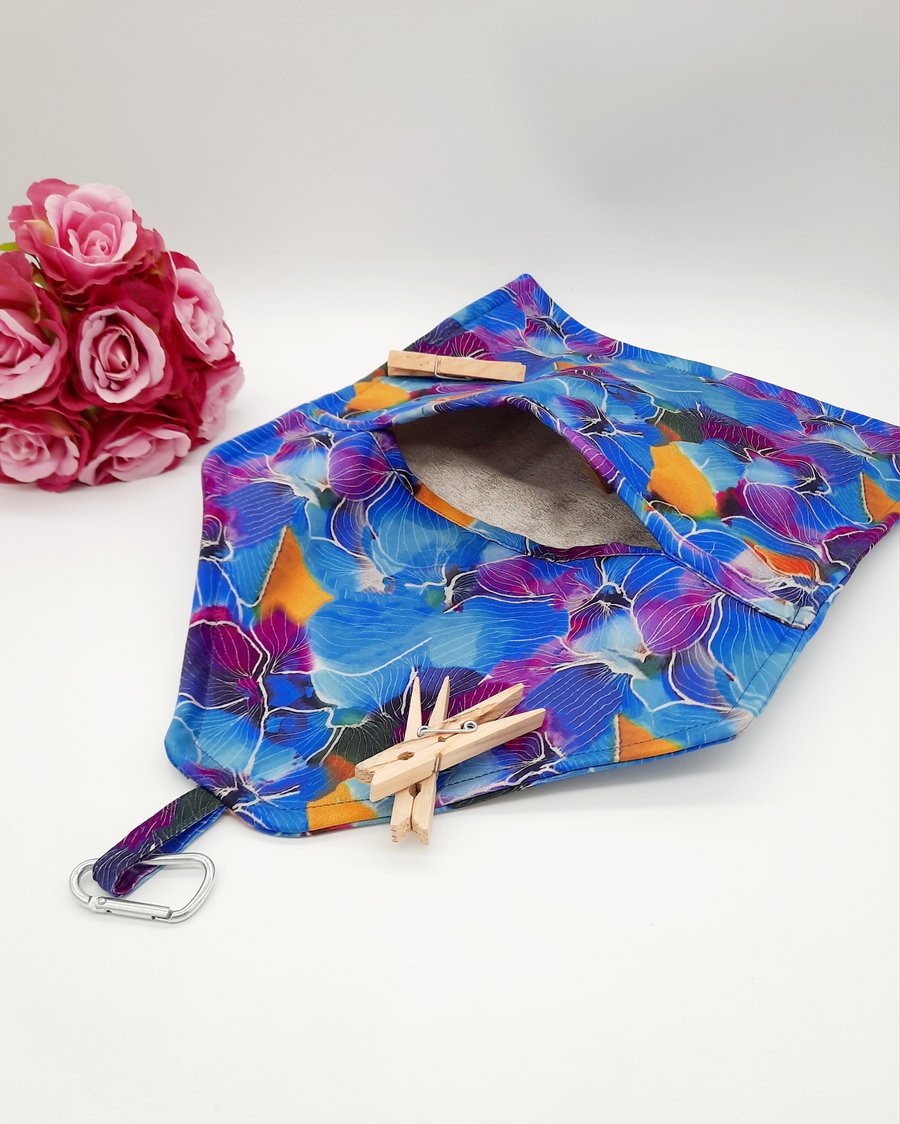 Blue and purple floral clip on peg bag. 
