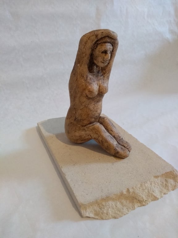 SEATED WOMAN small sculpture in clay  on stone plinth
