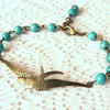 Beaded Bracelet with Bird Connector and Turquoise
