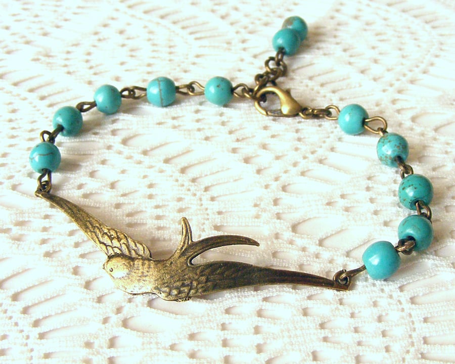 Beaded Bracelet with Bird Connector and Turquoise