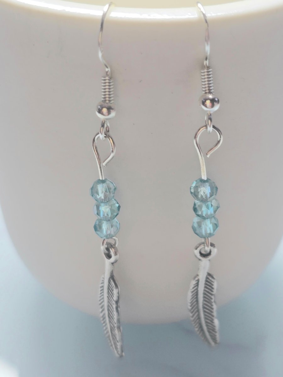 Blue feather charm earrings