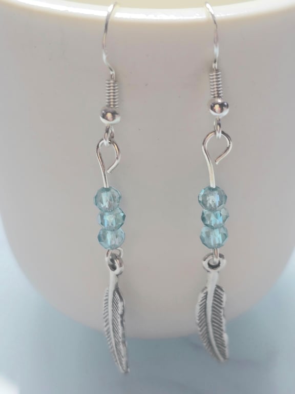 Blue feather charm earrings