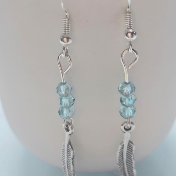 Blue feather charm earrings