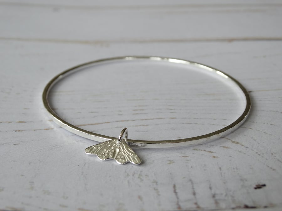 Hammered recycled sterling silver bangle with mini moth charm
