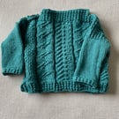 Hand knitted Gansey style jumper for a baby