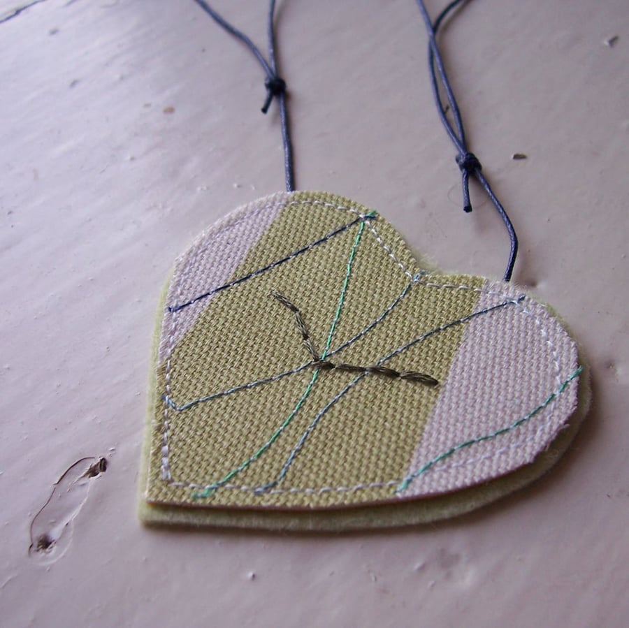 Ocean bird, heart shaped, hand and machine embroidered necklace
