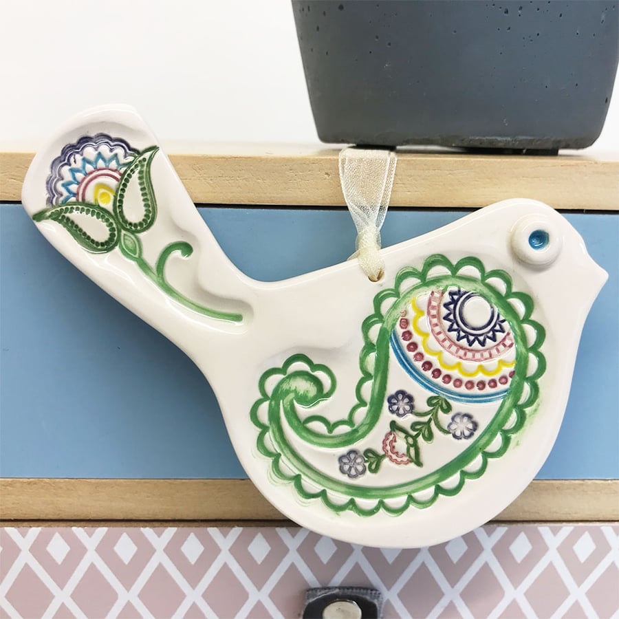 Ceramic bird decoration with patterned wing and tail 