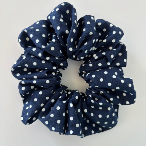 Cotton scrunchie hair accessory in navy and white spot design