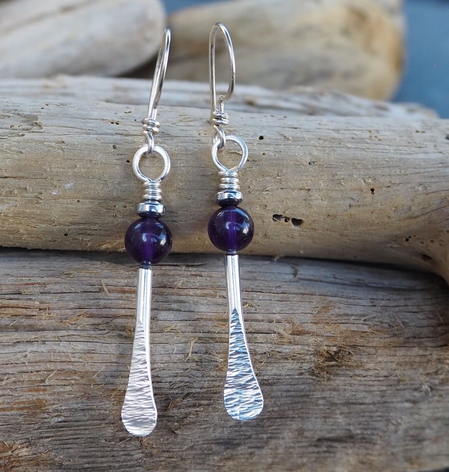 Forged silver rod dangle earrings with amethyst and hematite beads.