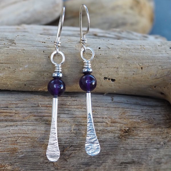 Forged silver rod dangle earrings with amethyst and hematite beads.