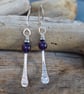 Forged silver rod dangle earrings with amethyst and hematite beads.