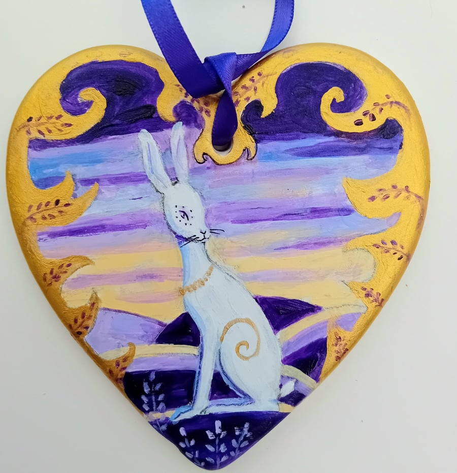 White hare on ceramic heart with  purple  and gold