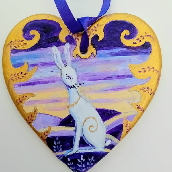White hare on ceramic heart with  purple  and gold
