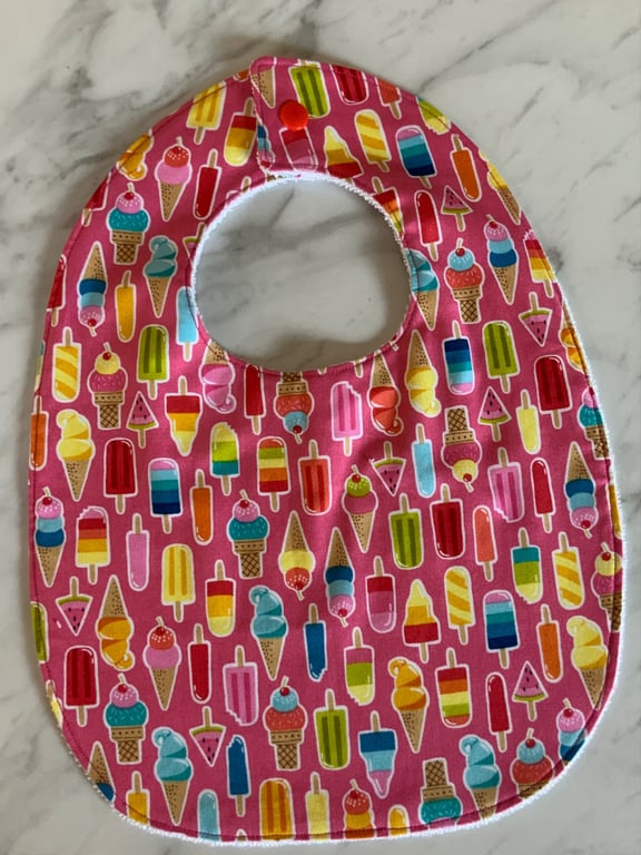 Bib, toddler size.  Gorgeous pink background with lollipops. Cotton with bamboo.