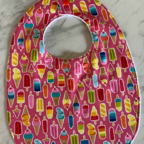 Bib, toddler size.  Gorgeous pink background with lollipops. Cotton with bamboo.