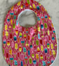 Bib, toddler size.  Gorgeous pink background with lollipops. Cotton with bamboo.