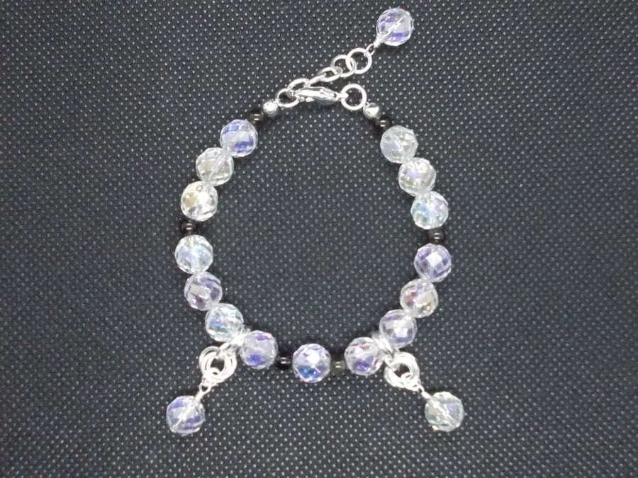 Coated clear quartz bracelet