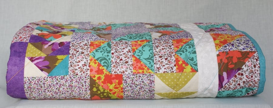 Multi-coloured puzzle quilt