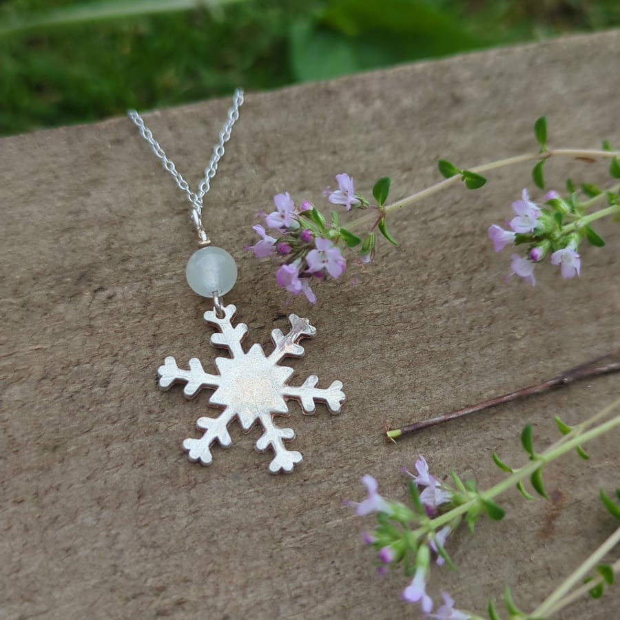 Overwhelm reducing silver snowflake necklace  