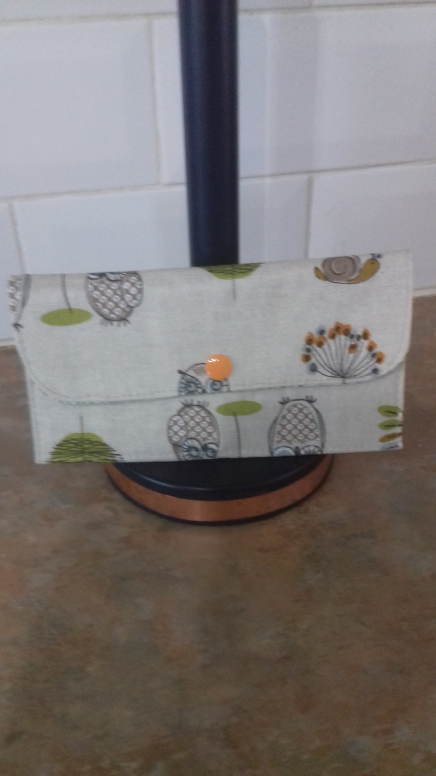 Long wallet in woodland friends fabric with orange popper.