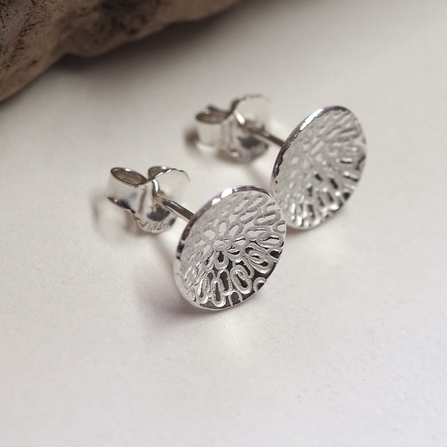 Earrings. Studs, silver domed and textured stud earrings.