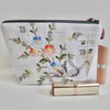 Make up bag in reclaimed vintage embroidery and pink fabric lining