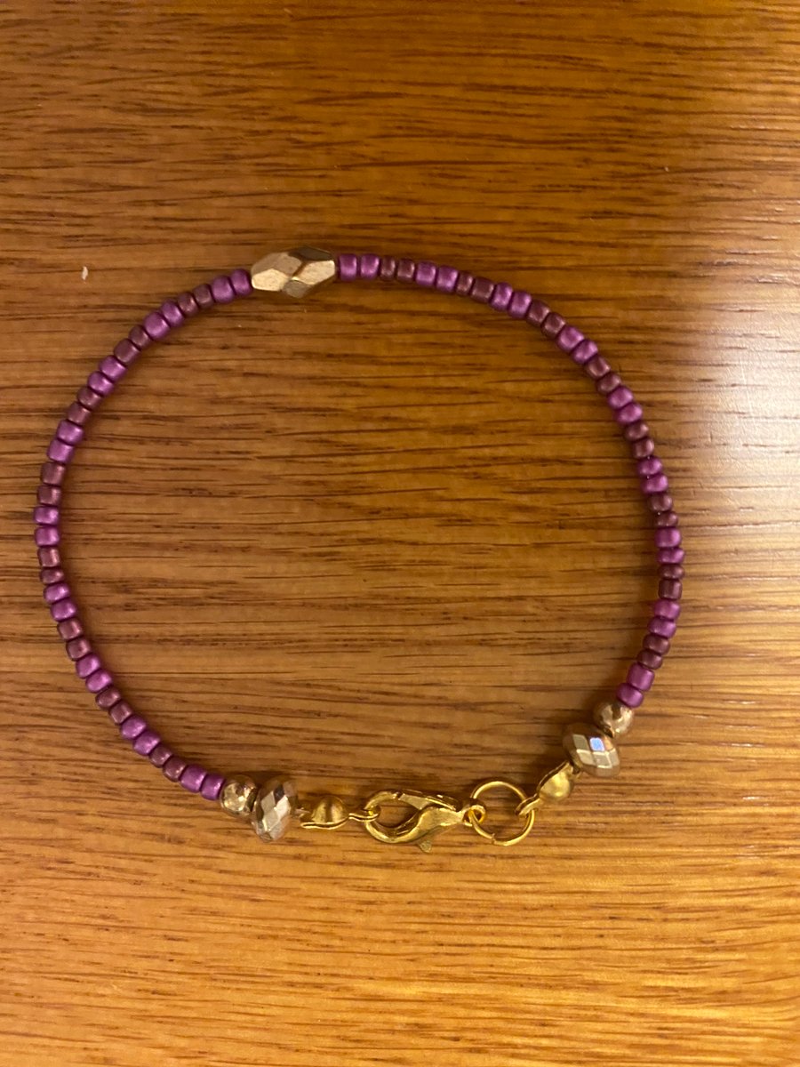 Purple and Gold coloured bracelet