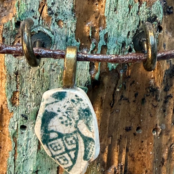 Green sea pottery pendant