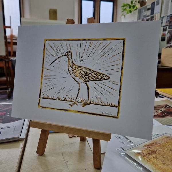 Curlew lino print. A4 hand printed. Yellow ochre and black ink.