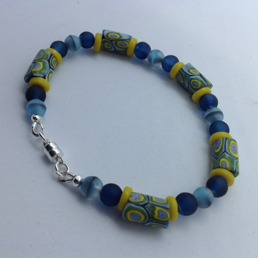 A pastel bracelet made with rare antique trade beads and a sterling silver clasp