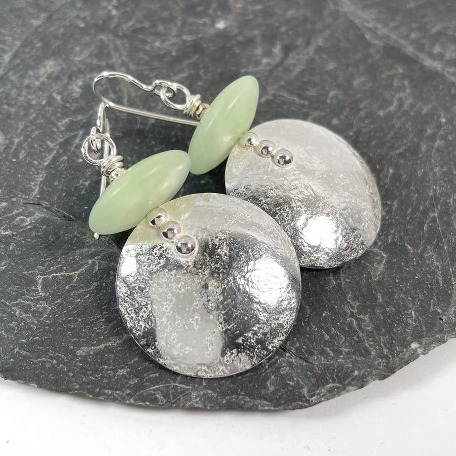 Large round silver and pale green stone earrings 
