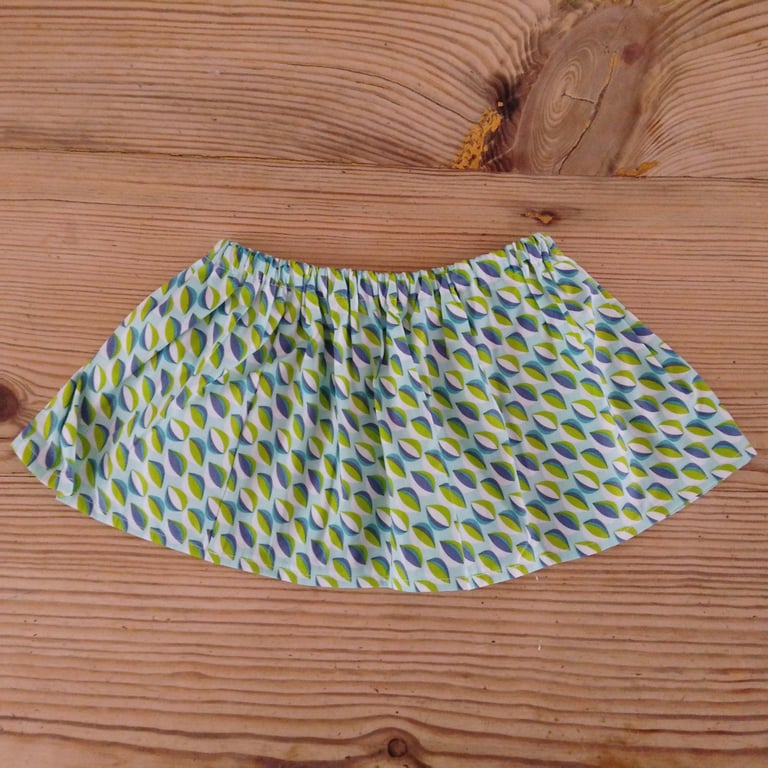 Baby skirt handmade in a blue and green patterned fabric age 6-9 months