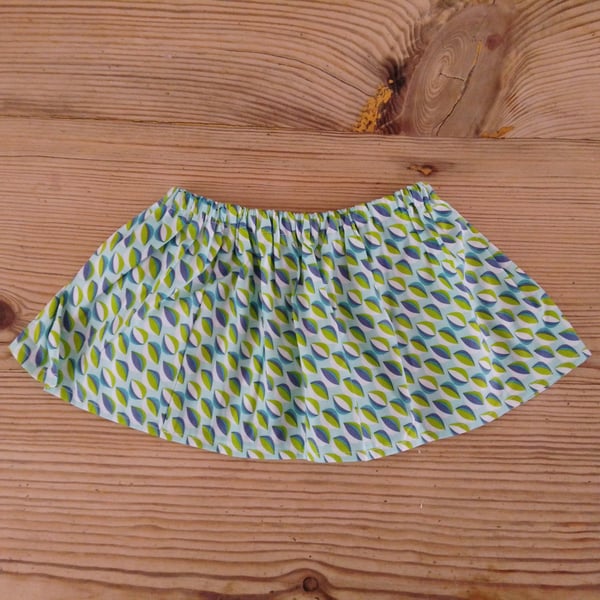 Baby skirt handmade in a blue and green patterned fabric age 6-9 months