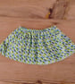 Baby skirt handmade in a blue and green patterned fabric age 6-9 months