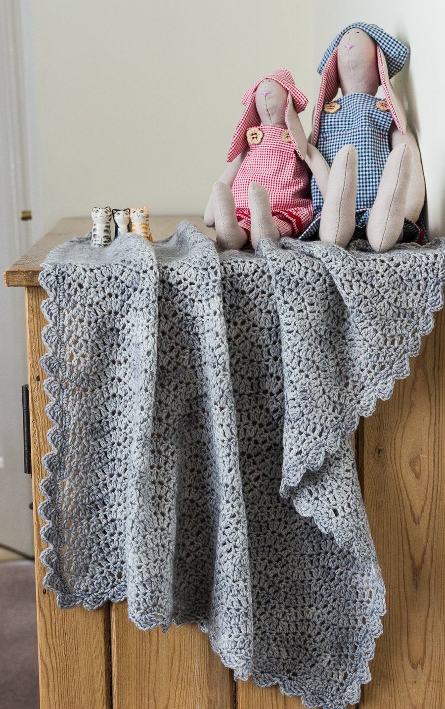 Small crocheted baby blanket made with a merino and cashmere